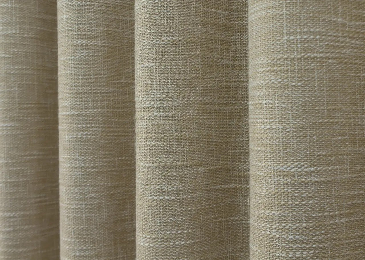 Eco-friendly light beige linen curtains, crafted from breathable fabric for soft light diffusion and privacy.
