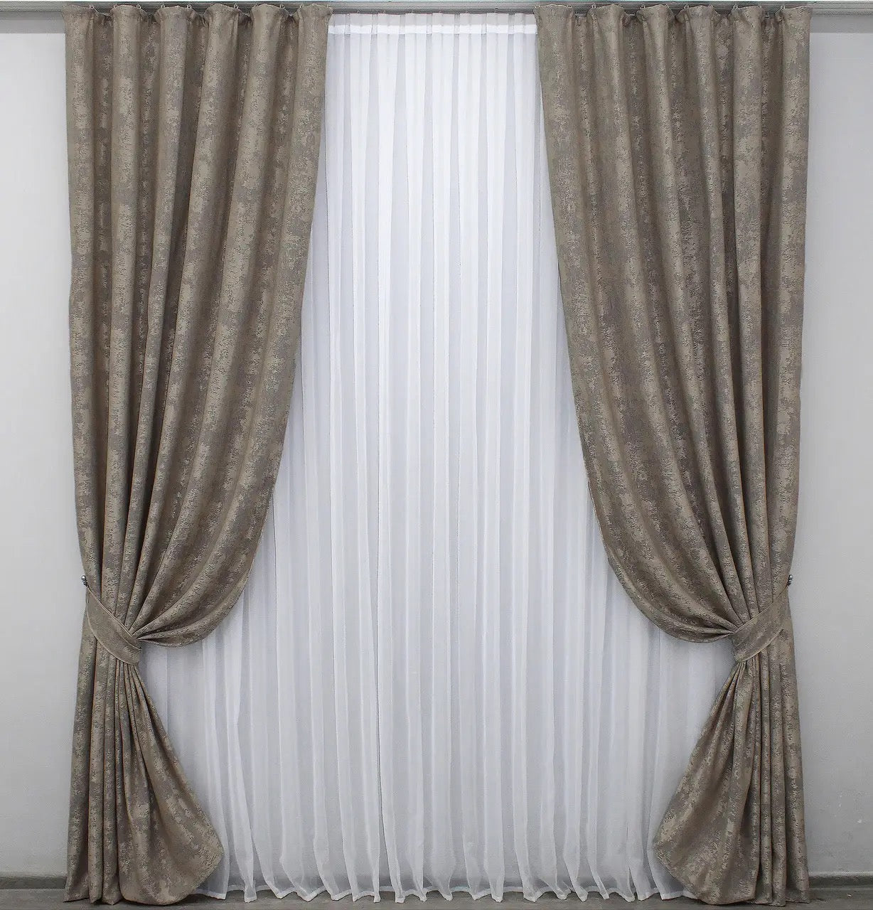 Luxury beige-grey jacquard curtains featuring a delicate woven pattern, enhancing modern and classic home interiors.
