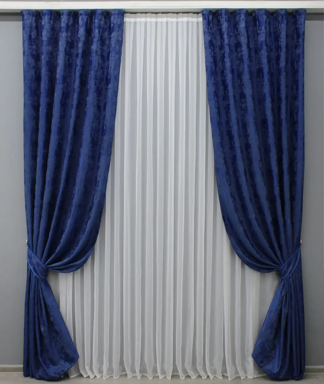 Luxury blue jacquard curtains featuring a soft, textured design, ideal for living rooms and bedrooms.
