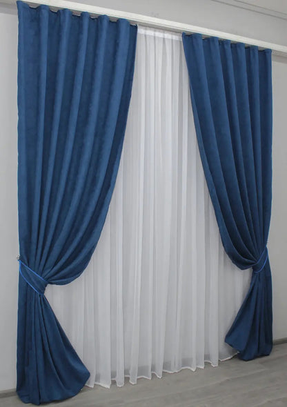 Luxury deep blue drapes, offering privacy and refined elegance in any space.
