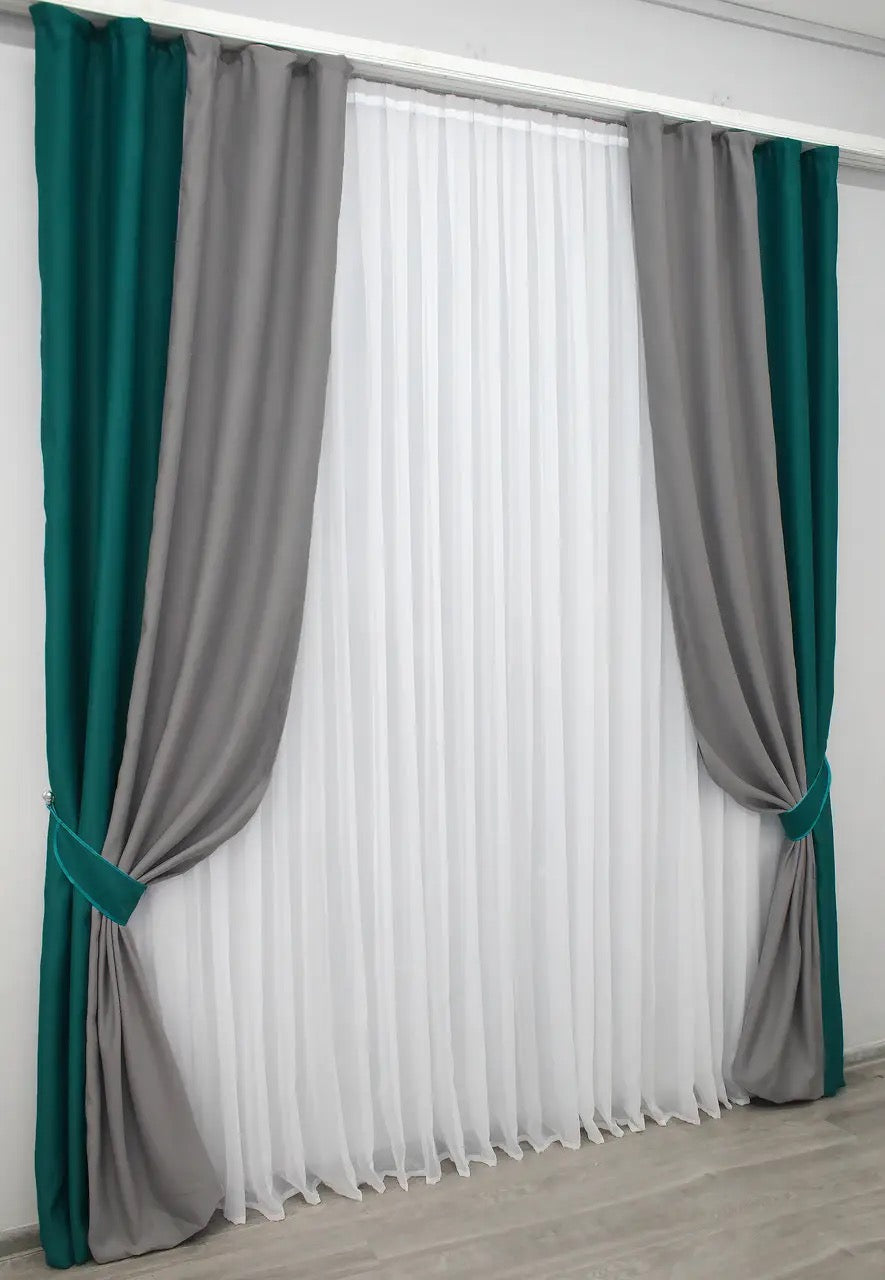 High-quality combined blackout curtains in emerald and grey, enhancing any space with stylish contrast.
