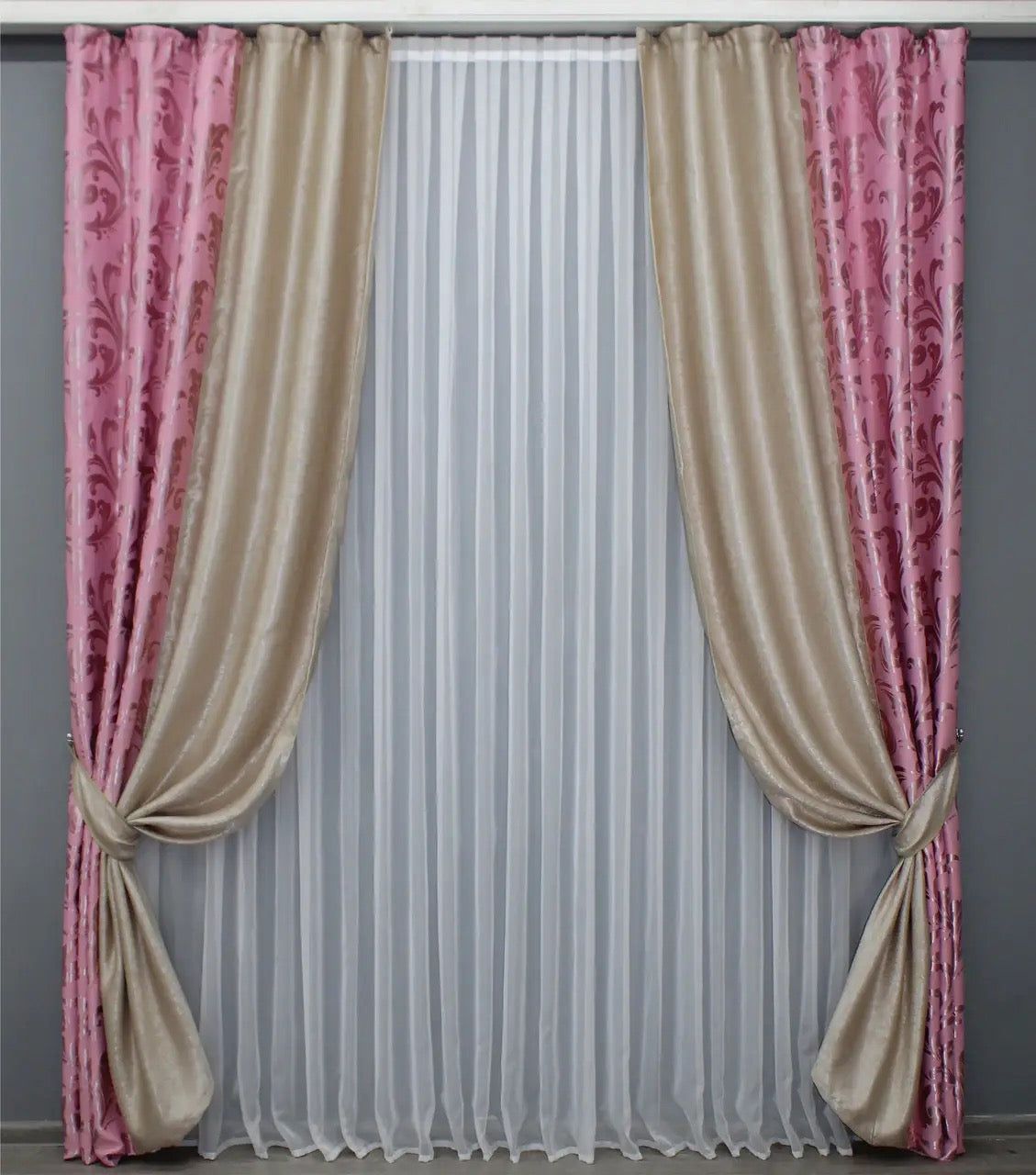 Elegant pink and beige two-tone blackout curtains made from soft fabric, ideal for creating a cozy and stylish atmosphere.
