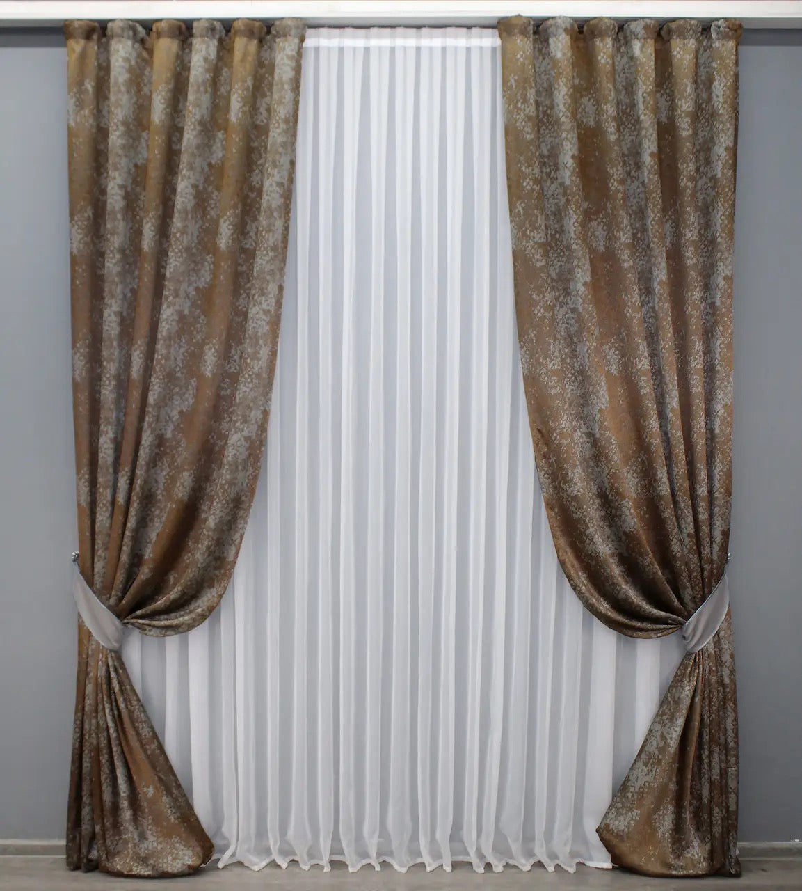 Elegant copper and grey linen drapes with a delicate marble pattern, offering a sophisticated touch to any space.
