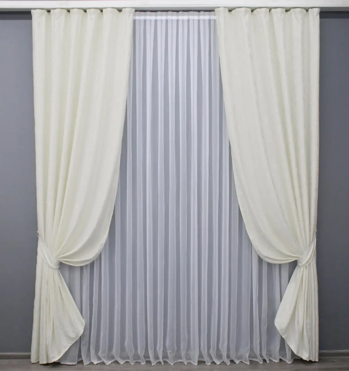 Soft-textured cream linen drapes, adding warmth and sophistication to any modern or classic home.
