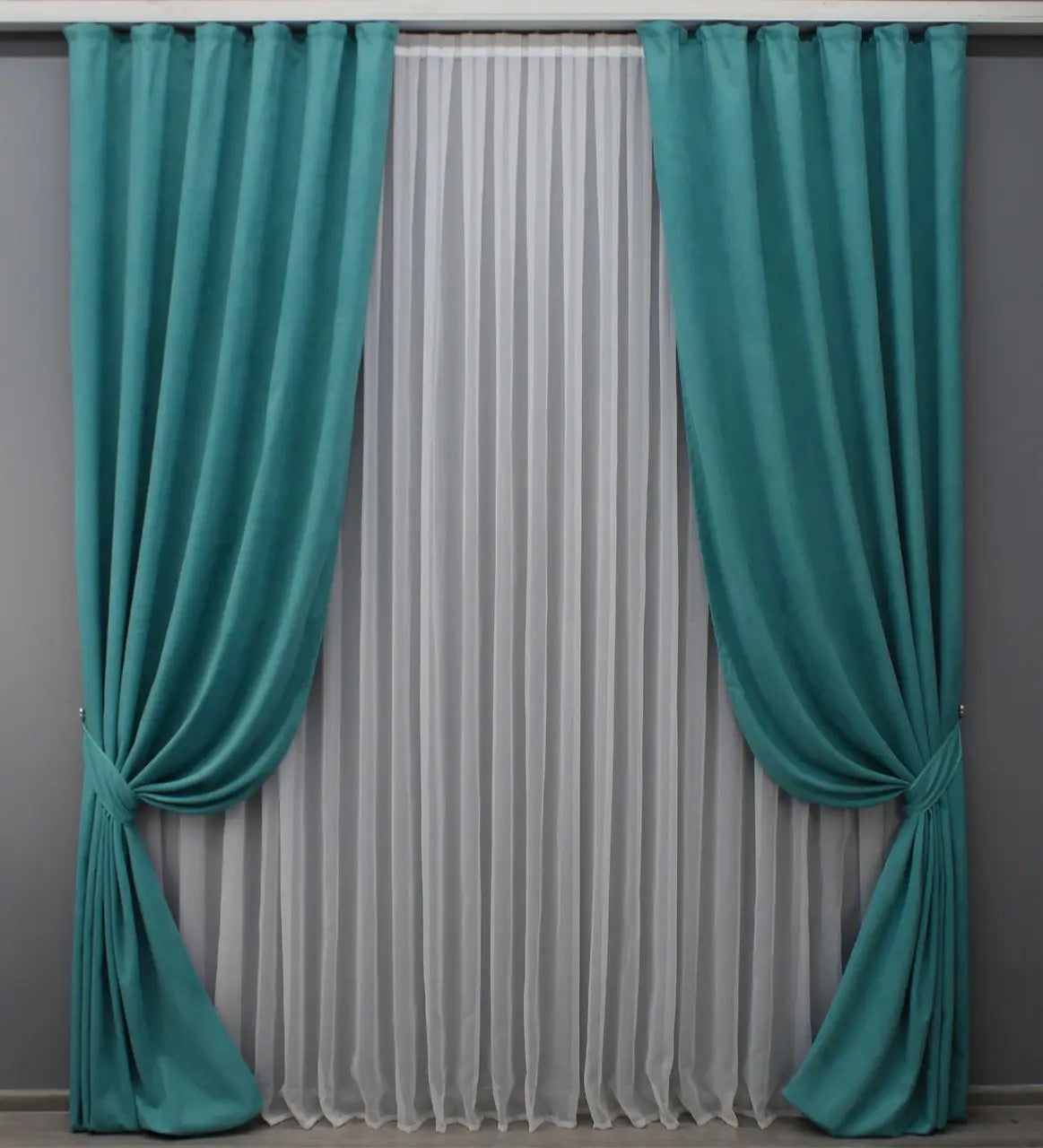 Premium deep turquoise velvet curtains with a plush texture, perfect for stylish bedrooms and living rooms.
