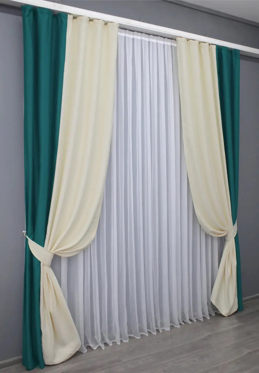 Elegant two-tone emerald and cream blackout curtains, ideal for creating a refined and cozy atmosphere in any room.
