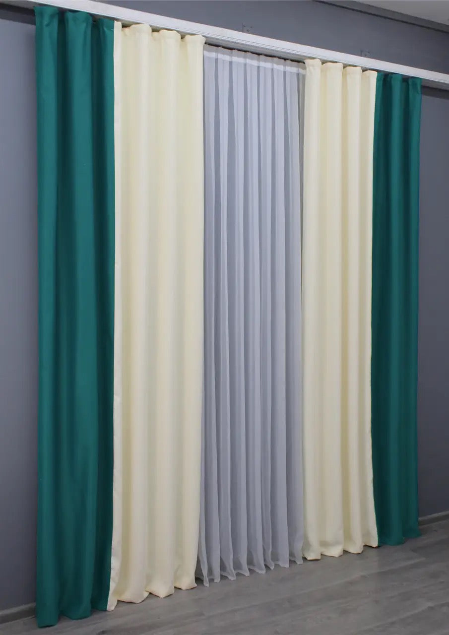 Elegant emerald and cream combined blackout curtains, providing a perfect balance of functionality and style for contemporary living spaces.
