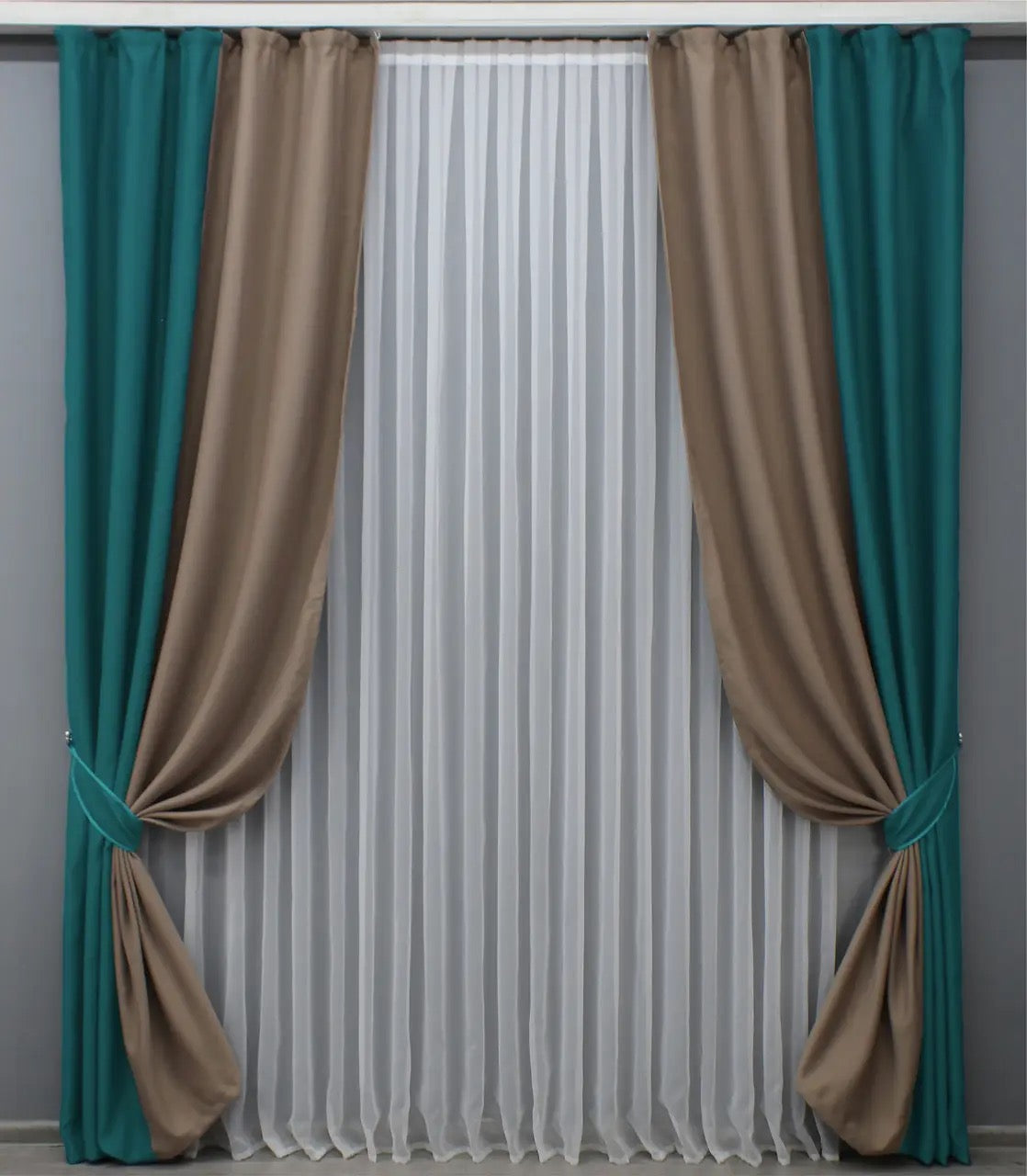 Elegant two-tone emerald green and dark beige blackout curtains designed to add a timeless touch to your home decor.
