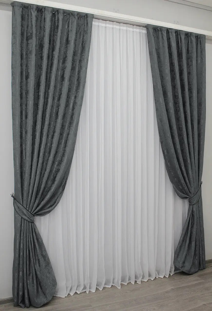 Contemporary graphite grey curtains made from premium jacquard fabric, providing a soft yet sophisticated look.
