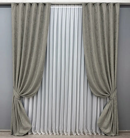 Premium grey linen drapes featuring a subtle marble effect, ideal for adding sophistication to any space.
