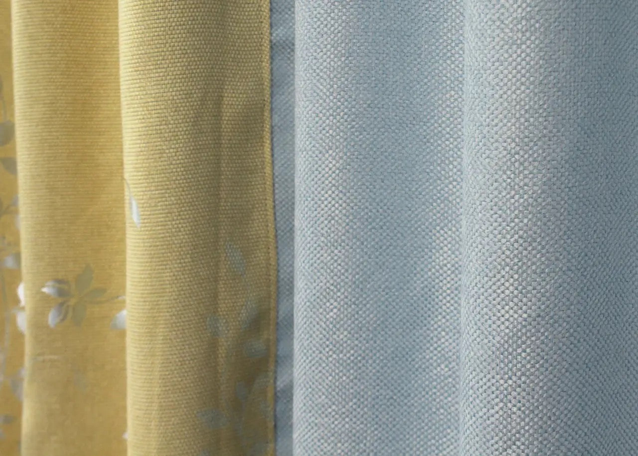 Elegant two-tone light blue and beige linen curtains, adding a stylish and sophisticated touch to your space with a relaxing color palette.
