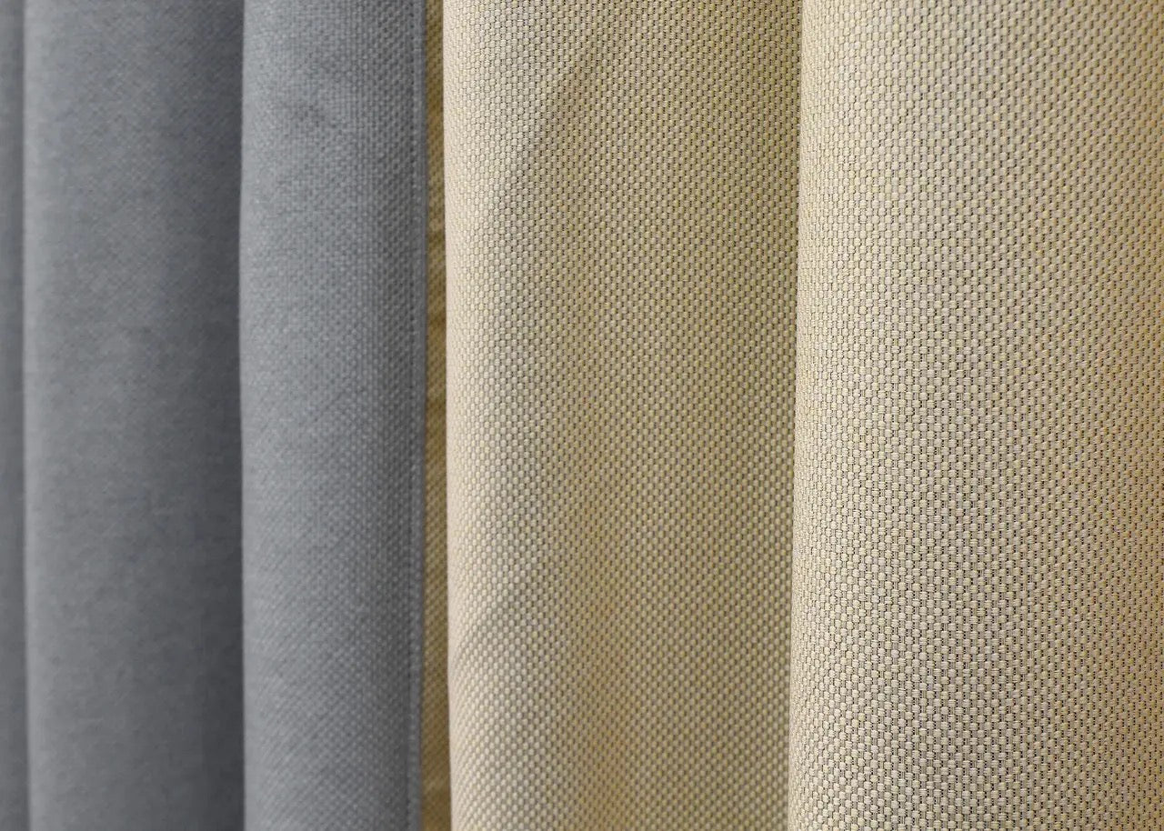 Timeless light grey and beige linen blackout curtains, ideal for enhancing both contemporary and classic interiors with a natural feel.
