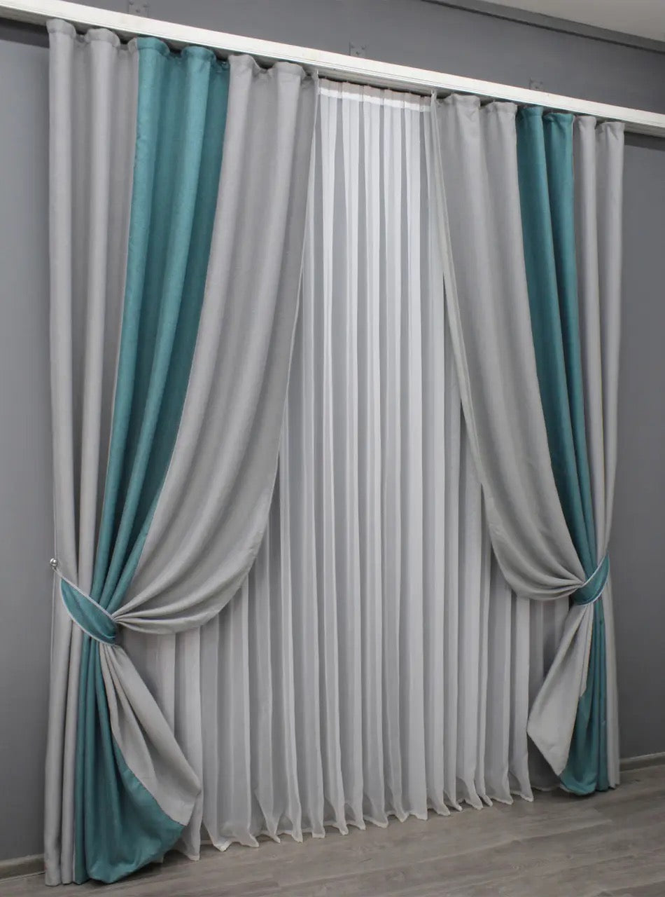 Stylish two-tone light grey and turquoise linen curtains, providing a natural feel and enhancing privacy while allowing soft natural light to filter through.
