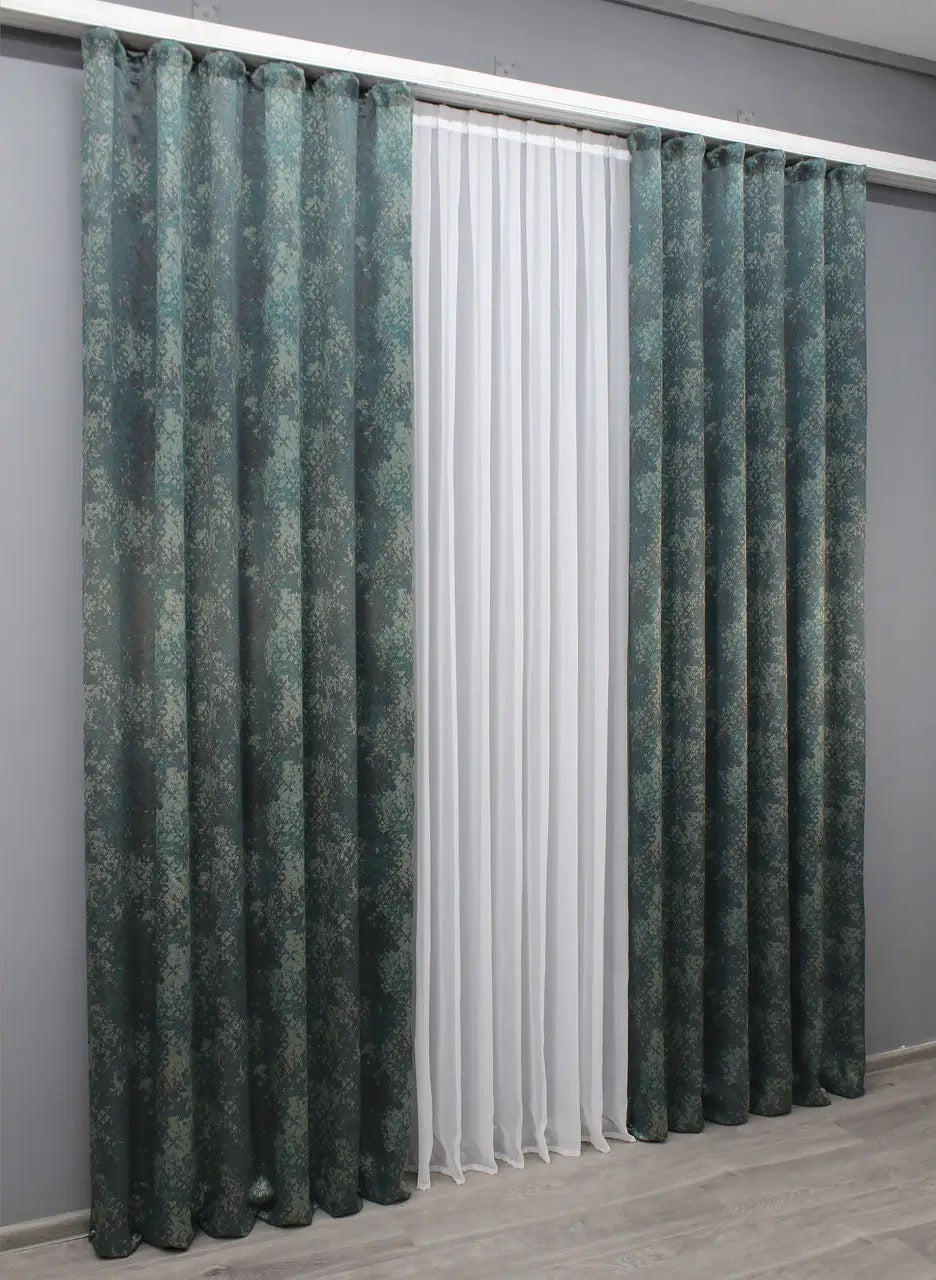 Soft-textured linen curtains in deep teal and grey, adding depth and elegance to any modern room.
