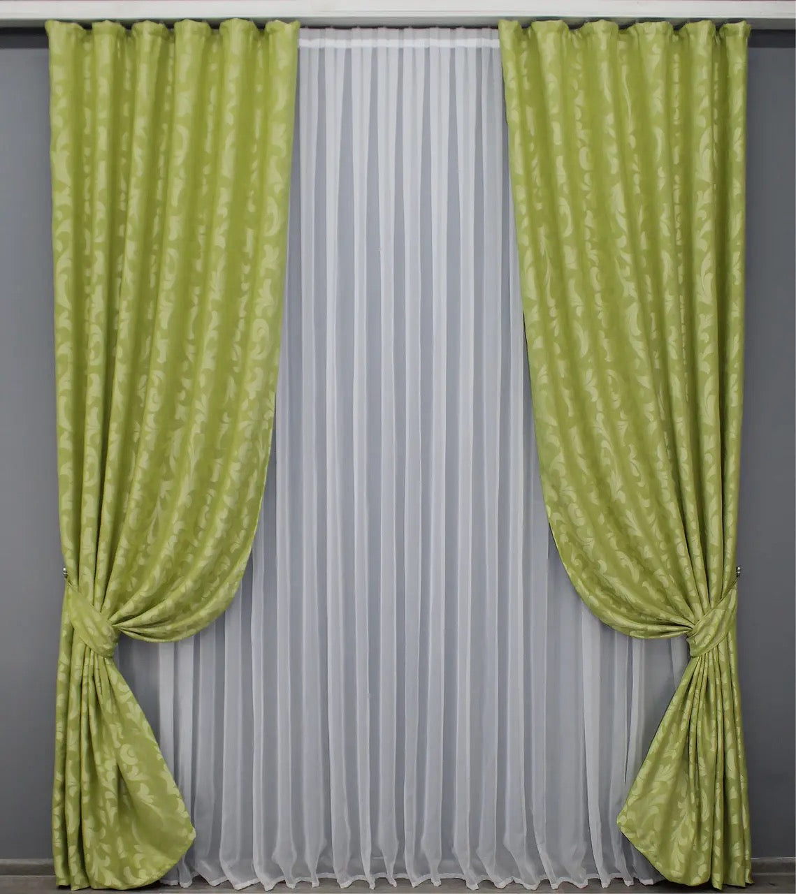 Luxury olive green Venzel drapes with an intricate decorative motif, adding sophistication to any room.
