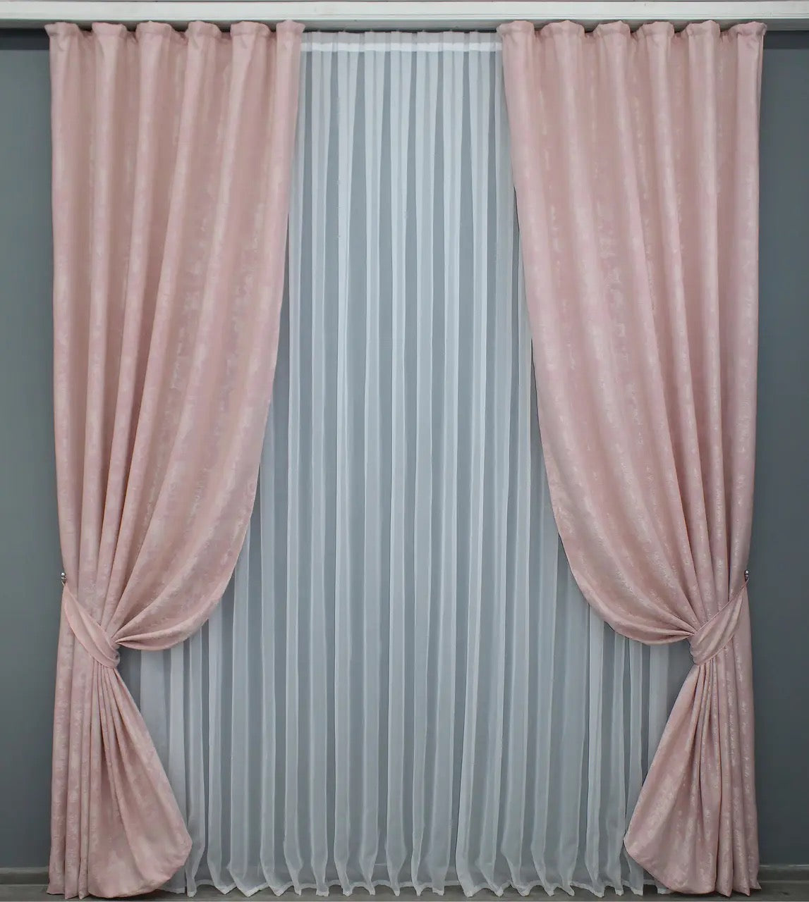 Luxury pale pink jacquard curtains featuring a textured design, enhancing living rooms and bedrooms with timeless elegance.
