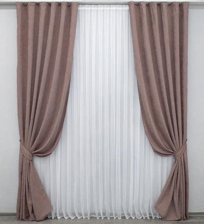 Luxury blush pink velvet curtains with a smooth texture, ideal for stylish bedrooms and living rooms.
