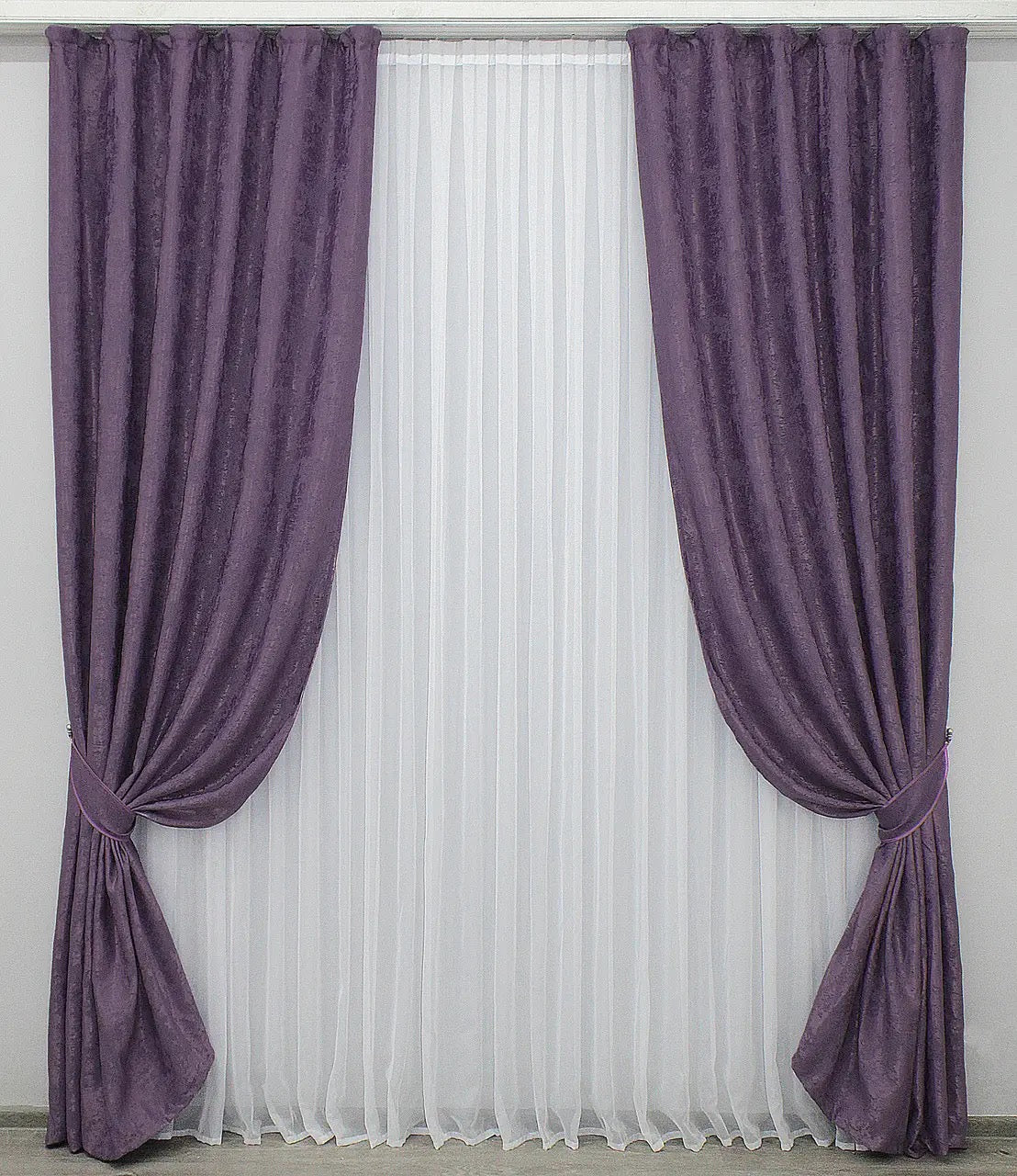 Luxury purple jacquard curtains featuring a bold regal tone, bringing elegance and style to living rooms and bedrooms.
