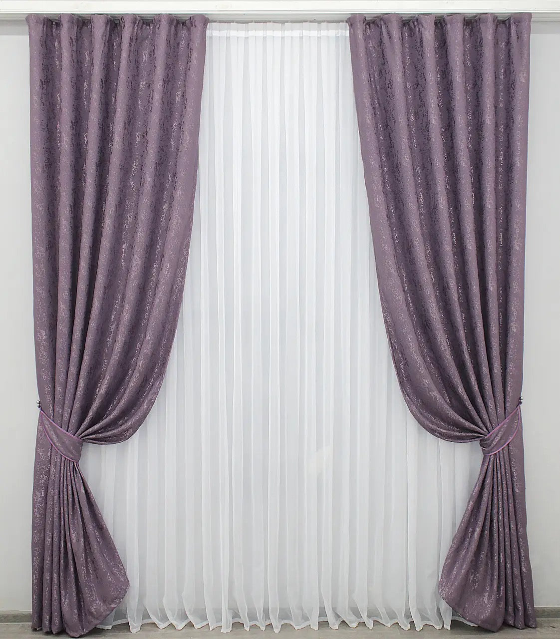 Luxurious purple linen drapes with a soft marble texture, perfect for sophisticated and stylish spaces.
