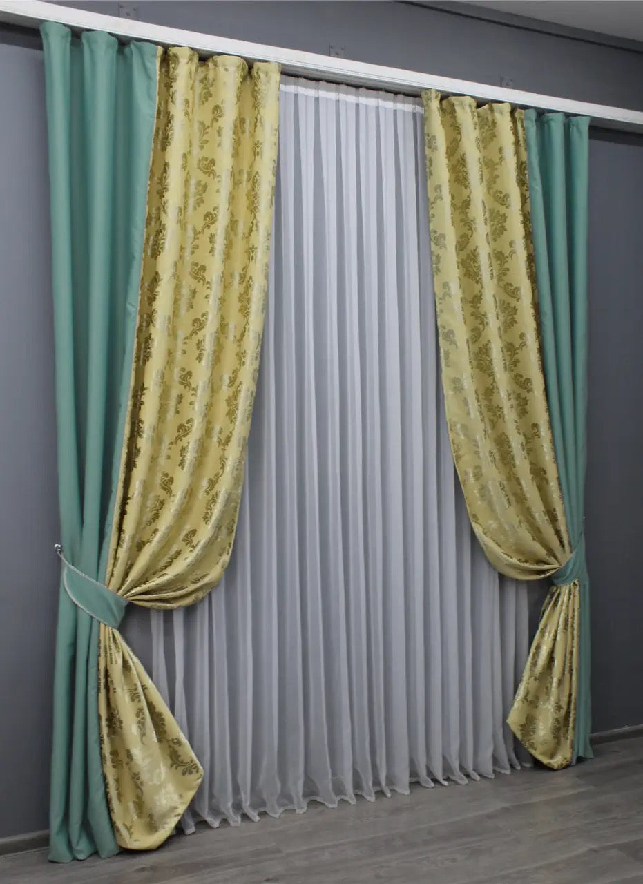 Elegant two-tone turquoise and beige blackout curtains that create a striking yet harmonious contrast in any room.
