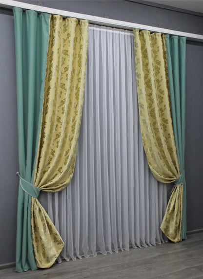 Elegant two-tone turquoise and beige blackout curtains that create a striking yet harmonious contrast in any room.
