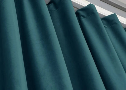 Emerald teal velvet curtain panels, featuring noise-absorbing properties and a smooth finish.
