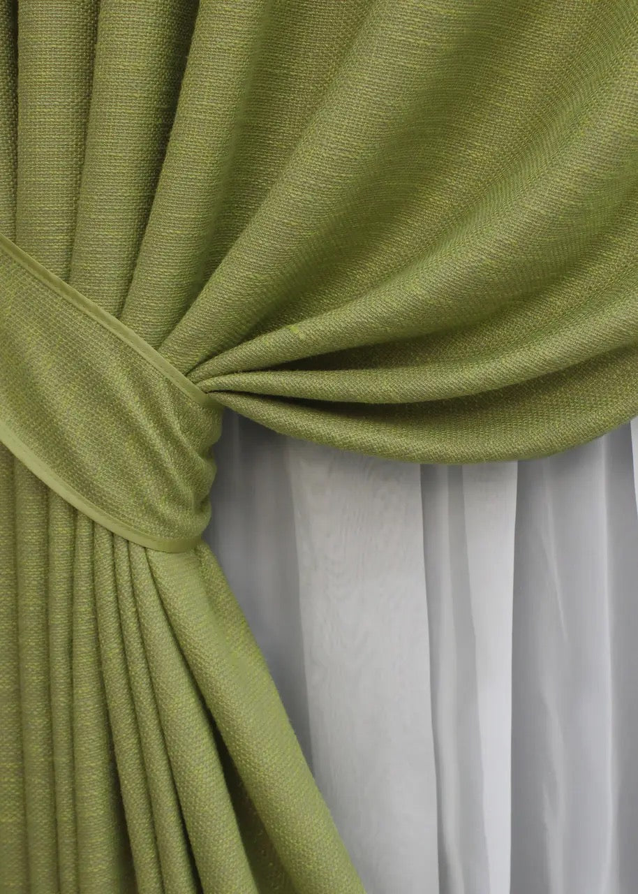 Botanical-inspired light green linen curtains, adding warmth and freshness to bright and airy home spaces.
