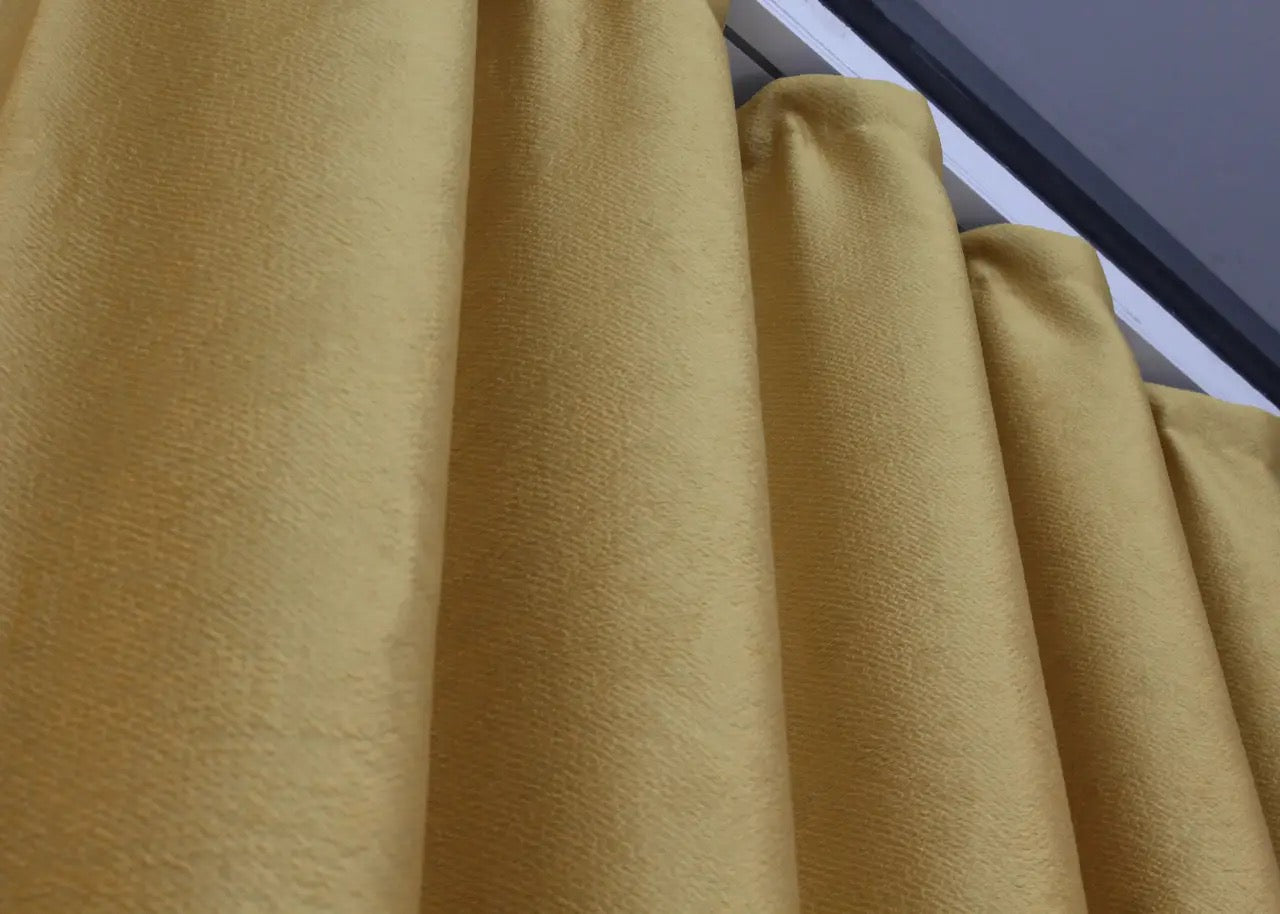 Farmhouse-style golden linen curtains with light-filtering properties for a warm and inviting atmosphere.
