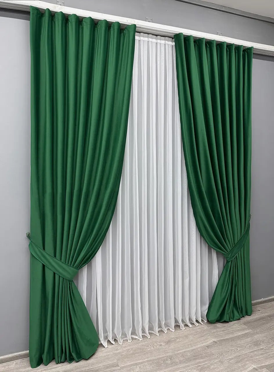 Forest green blackout velvet curtains with a premium soft-touch finish, ideal for modern and classic interiors.
