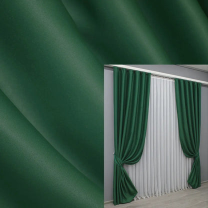 Forest green blackout curtains with a smooth drape and 95% light blocking.
