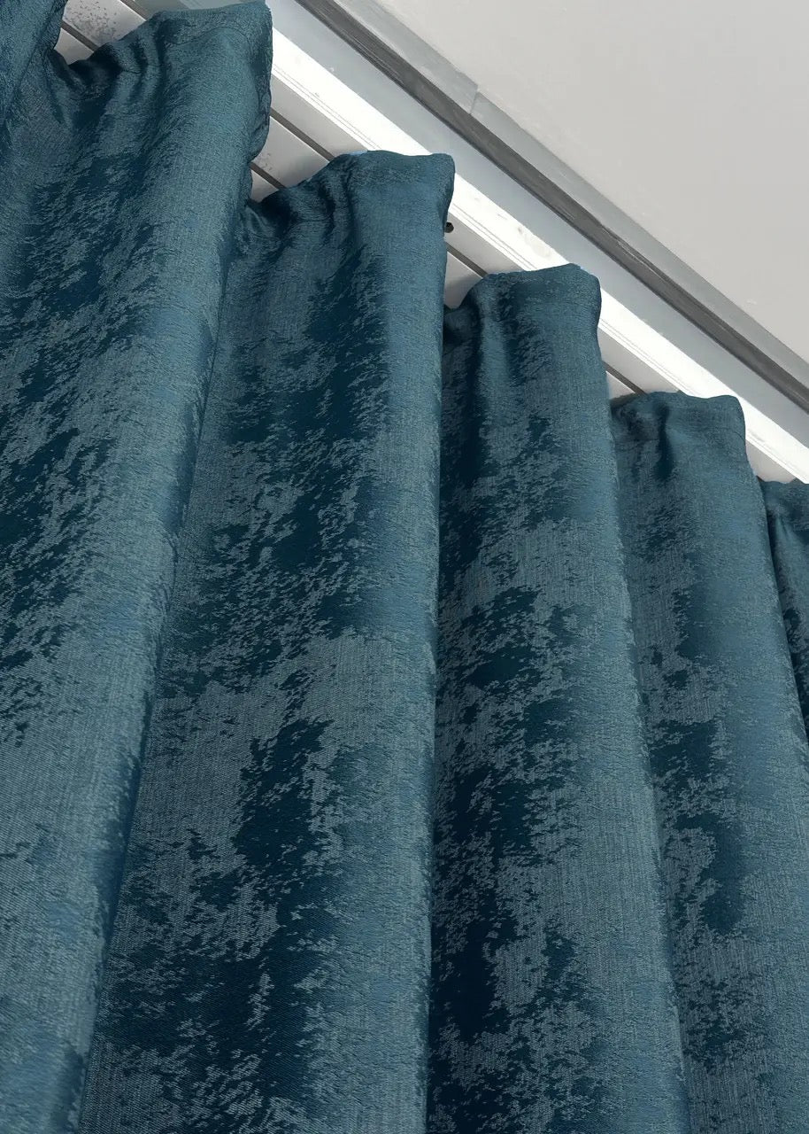 Fresh azure blue curtains with a sophisticated tone, seamlessly blending into elegant interior designs.
