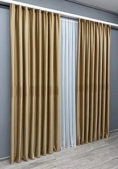 Golden beige premium velvet curtains with plush texture, reducing glare and enhancing room ambiance.