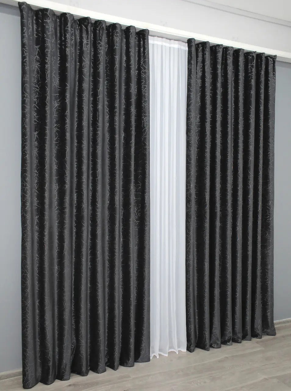 Graphite velvet blackout drapes with a rich, deep hue, perfect for adding luxury and privacy to any space.
