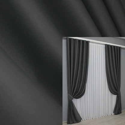 Luxury graphite grey blackout curtains with 95% light blocking and soft drape.
