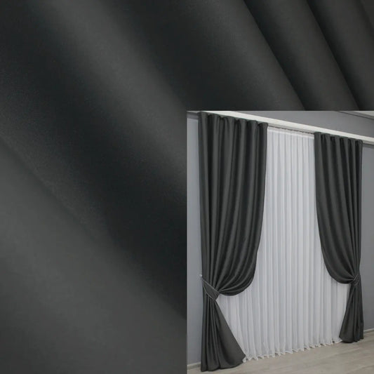 Luxury graphite grey blackout curtains with 95% light blocking and soft drape.
