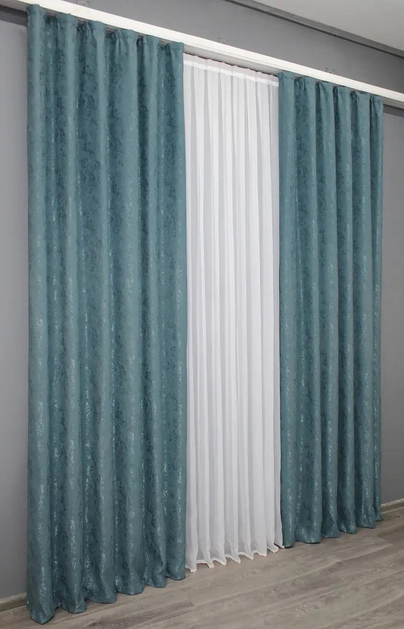 Contemporary azure linen drapes with a luxurious texture and timeless elegance.
