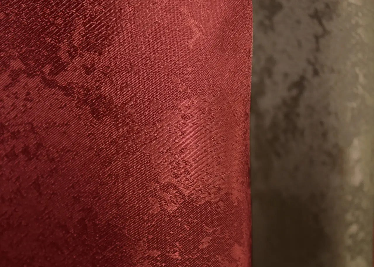 Stylish red and oxblood jacquard curtains, perfect for luxury interiors, offering exceptional privacy and light control for any modern or classic living space.
