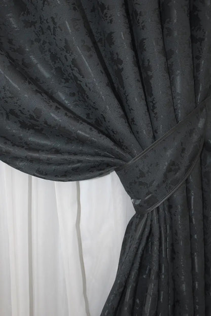 Premium blue-graphite linen drapes with a textured marble design, ideal for minimalist and contemporary interiors.
