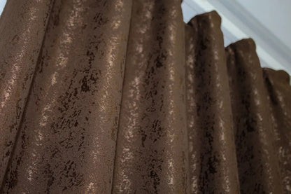 Soft brown linen curtains with a natural marble pattern, perfect for cosy living rooms and bedrooms.
