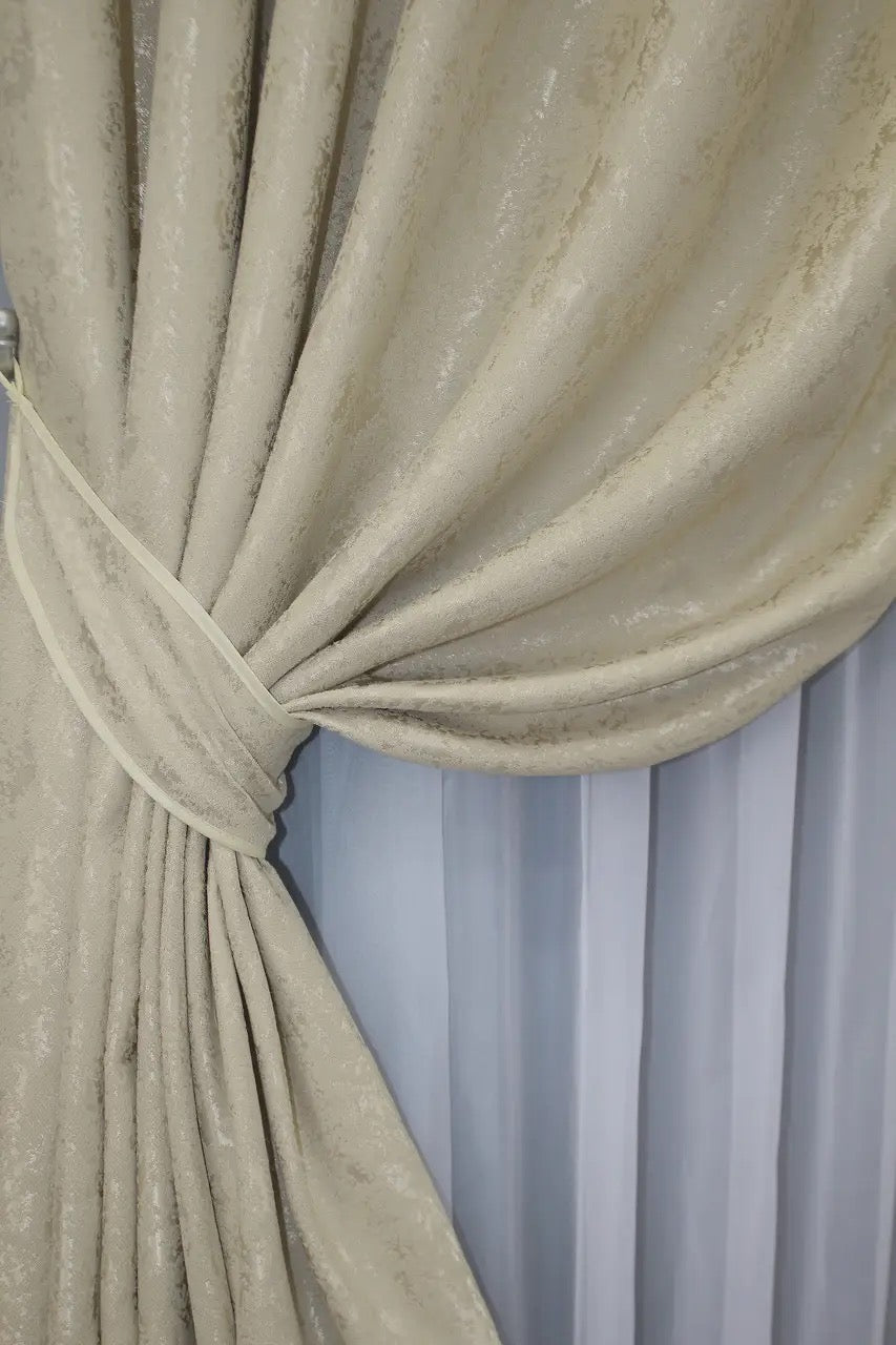 Premium champagne gold linen drapes with a delicate marble pattern, perfect for luxurious and refined interiors.
