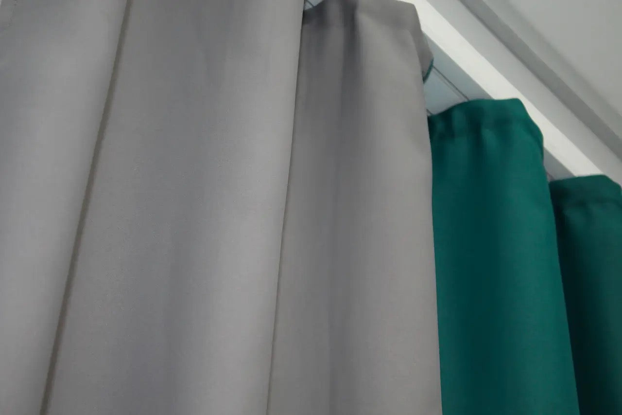 Emerald and grey combined blackout curtains with excellent light filtering and sophisticated design.
