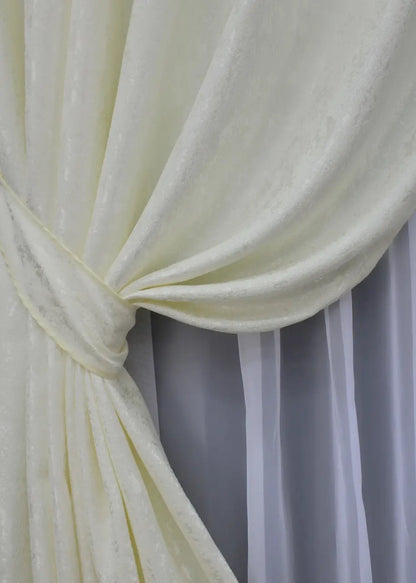 High-quality cream linen drapes with a subtle marble design, ideal for classic and contemporary interiors.
