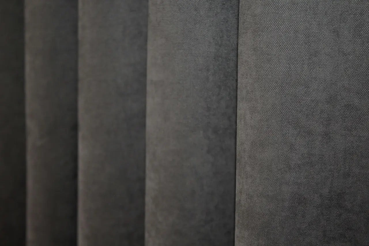 Soft-touch dark grey curtains with a smooth, flowing drape, perfect for bedroom décor.
