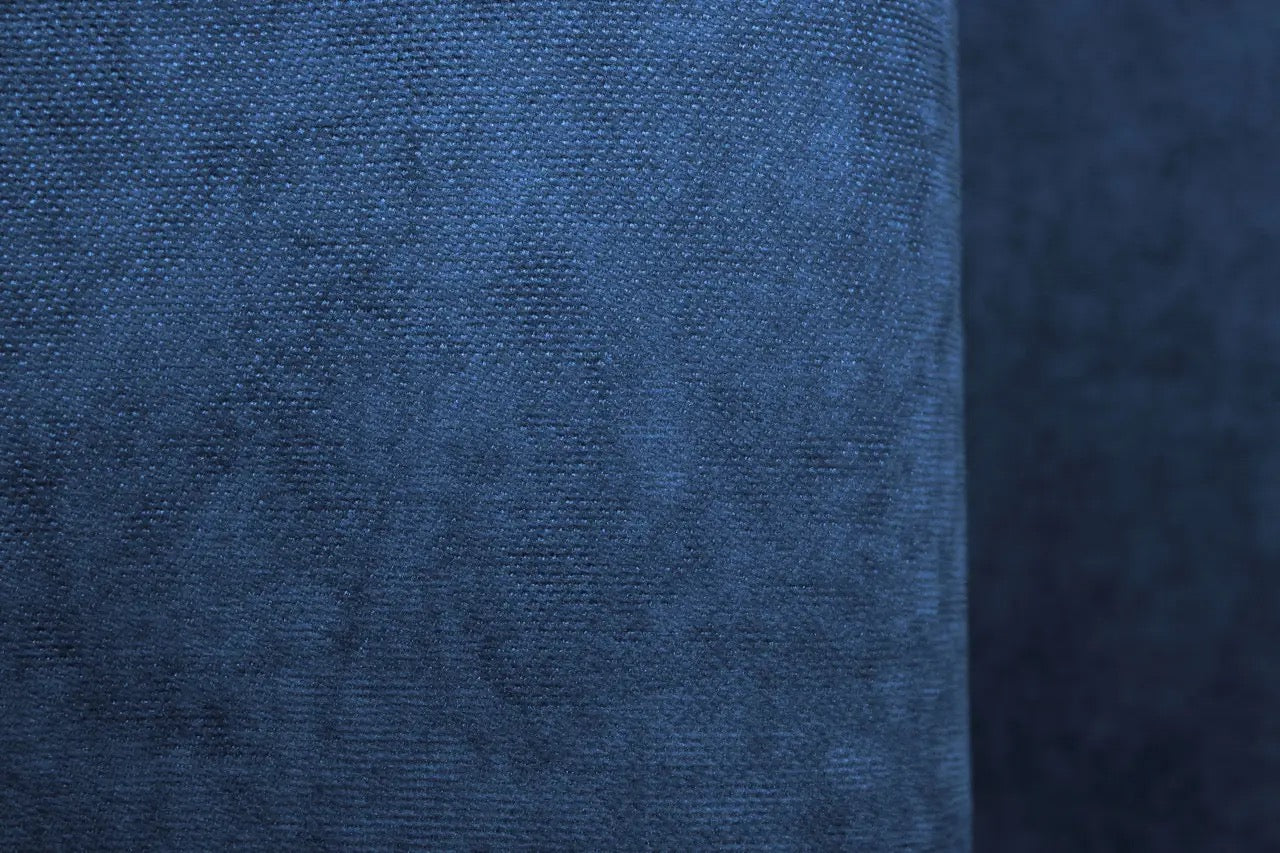 Chic deep blue curtains, providing privacy and a luxurious touch to modern interiors.
