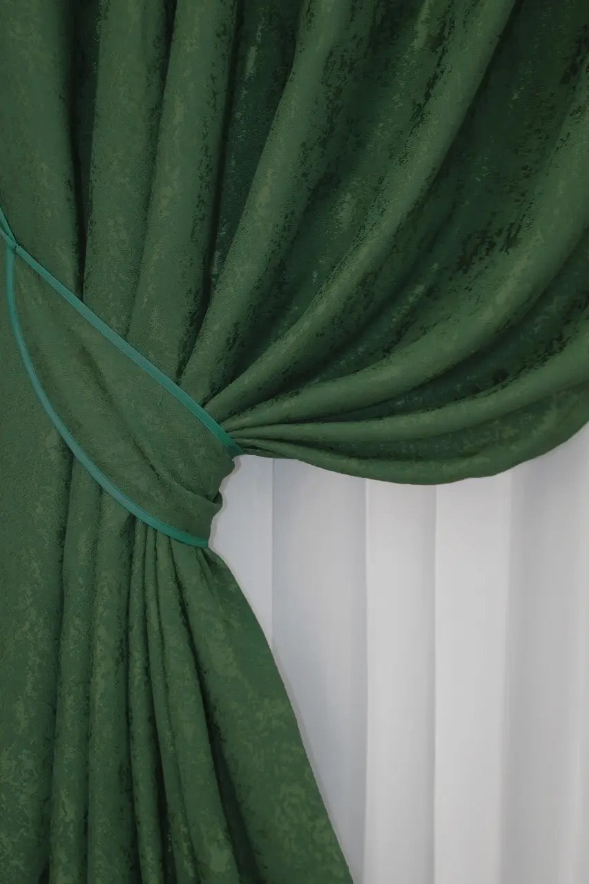 Luxury emerald green linen curtains with a refined pattern, enhancing the warmth and comfort of any room.
