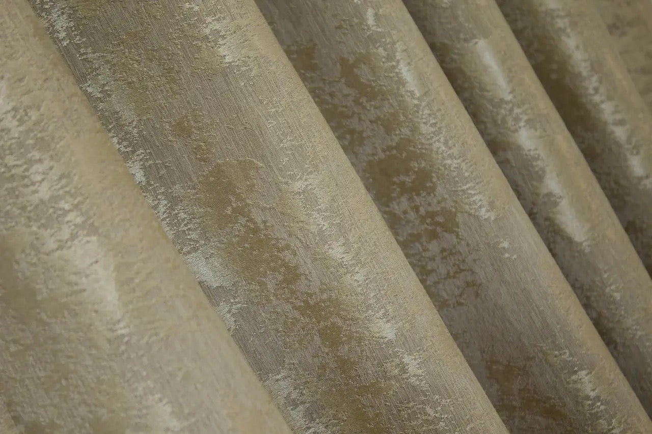 Opulent golden jacquard curtains with a soft, light-filtering effect, bringing depth and charm to home interiors.
