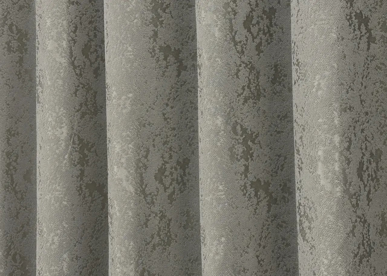 Minimalist grey linen curtains with a timeless marble pattern, suitable for stylish home decoration.
