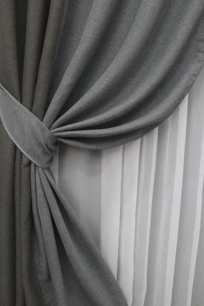 High-quality grey two-tone linen blackout curtains designed for elegant and comfortable spaces, offering privacy and light control.
