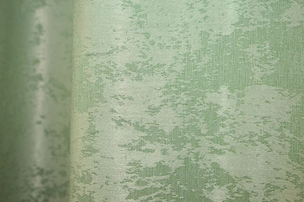 Soft mint jacquard curtains with a delicate woven texture, enhancing both modern and classic home interiors.
