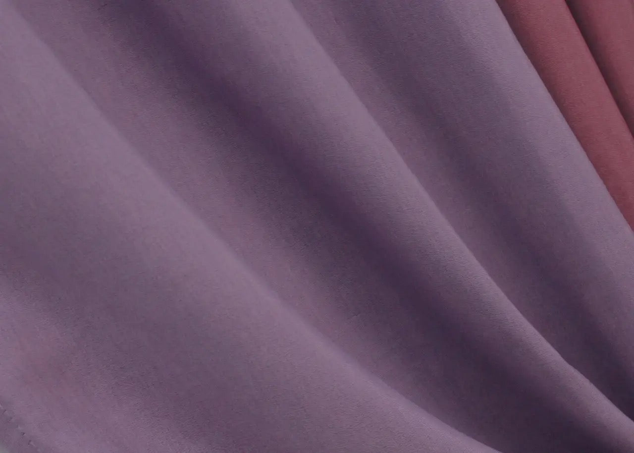 Vibrant raspberry and violet curtains with a luxurious drape and seamless contrast, ideal for making a bold statement in any room.
